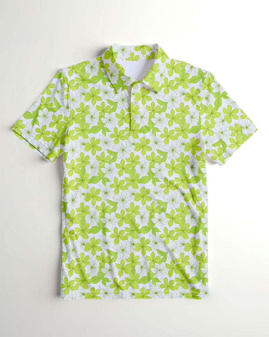 Green and white floral patterned polo shirt on a light gray background