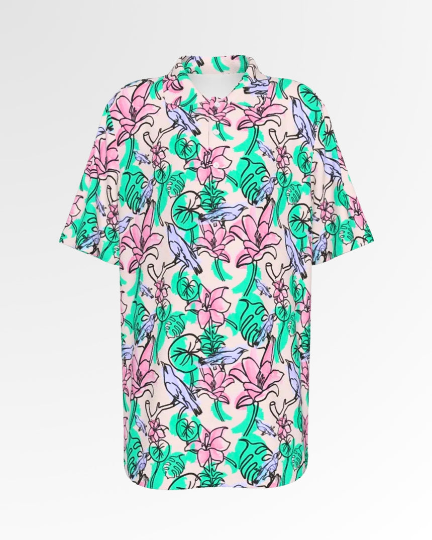 Golf polo shirt with a pink floral and bird pattern.