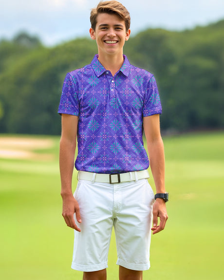 A smiling young man stands on a golf course wearing a patterned purple golf polo, white shorts, and a white belt.