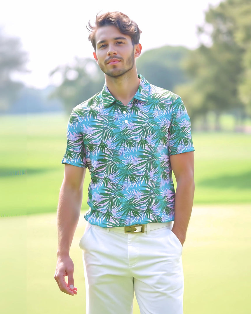 A man on a golf course wearing a tropical pink and green print golf polo shirt