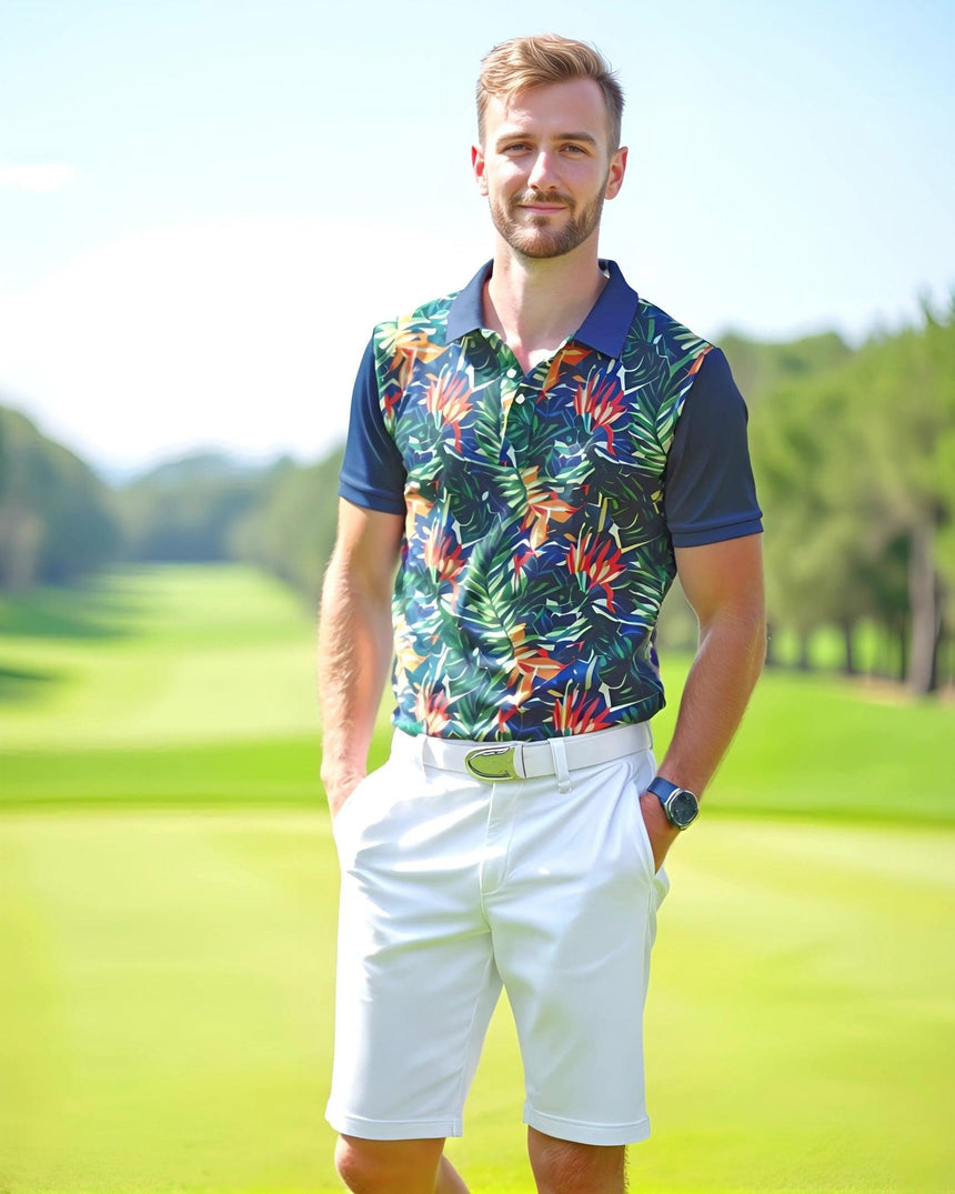 A man on a golf course wearing a blue leaves pattern golf shirt and white shorts