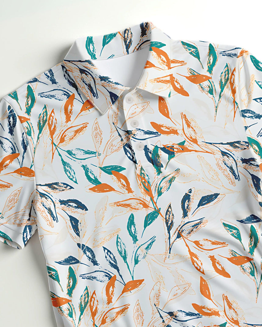 Close up of a short-sleeve shirt with colorful leaf pattern