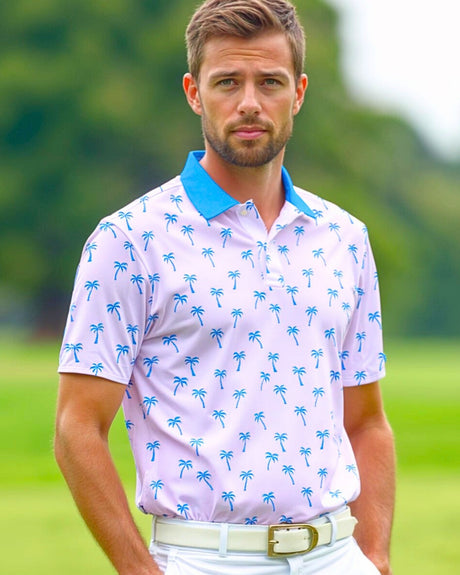 Man wearing a pink tropical print golf polo shirt on a golf course