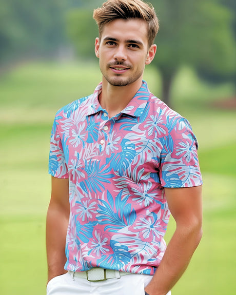 A man on a golf course wearing a pink and blue tropical print golf shirt