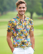Man wearing a colorful tropical golf shirt on a golf course