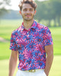 Man wearing a colorful floral polo shirt on a golf course