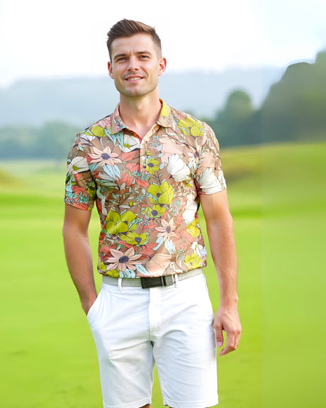 Man wearing a colorful floral golf polo and white shorts standing on a golf course.