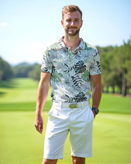 Man in a tropical golf polo and white shorts standing on a golf course