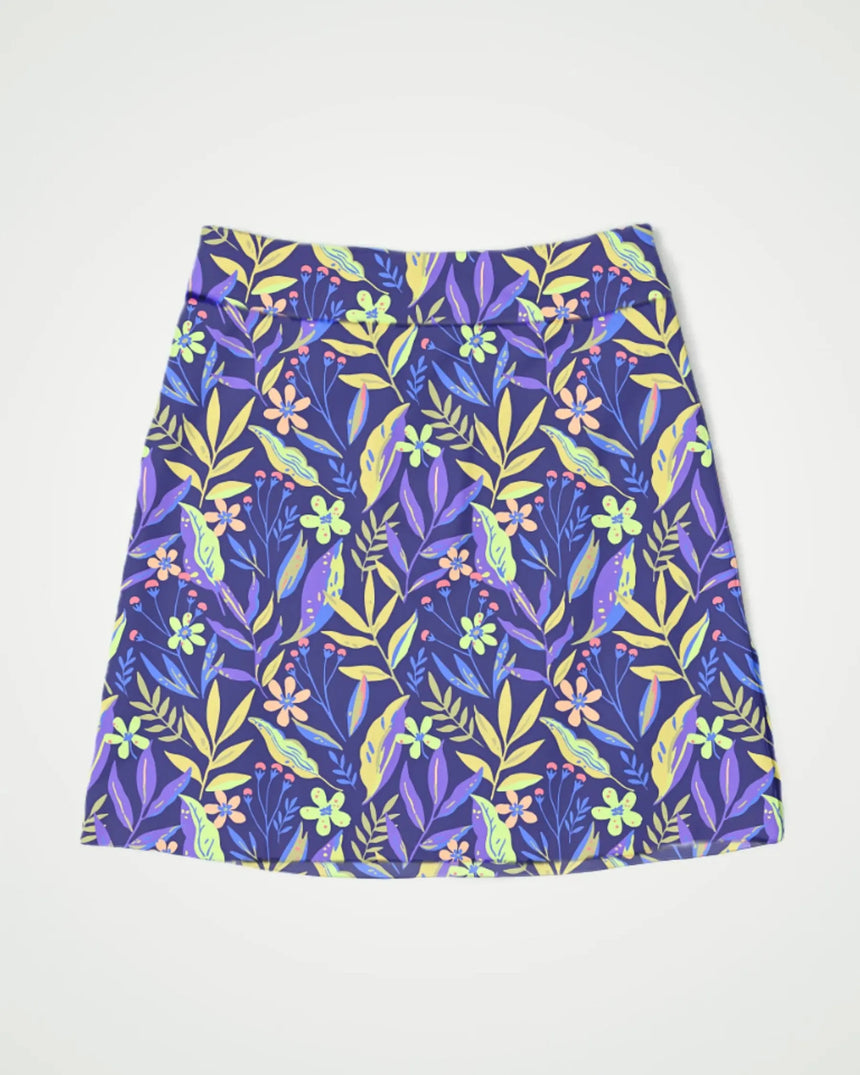 women's fitted golf skort with pockets in Garden on the Green print - front view
