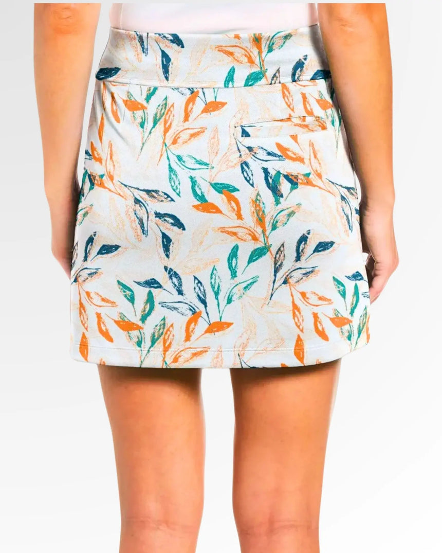 women's fitted golf skort with pockets in Leaf It On the Green print - back view