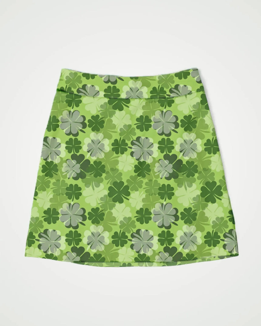 women's fitted golf skort with pockets in Lucky Clover print - front view
