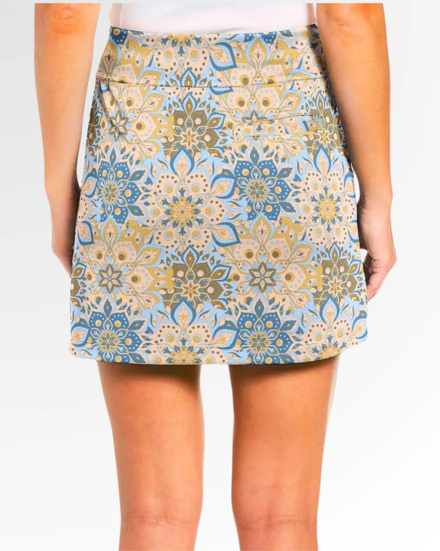 women's fitted golf skort with pockets in Retro Botanic print - back view