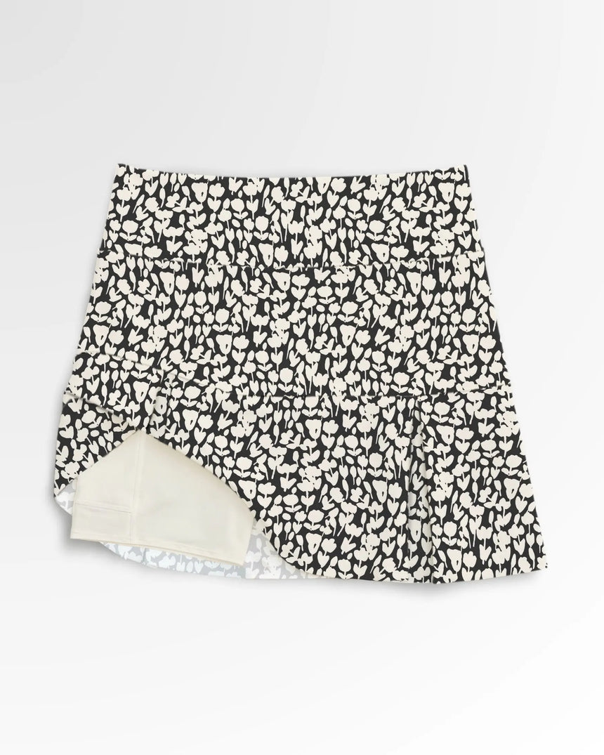 women's pleated golf skort with pockets in Midnight Meadow print - front view