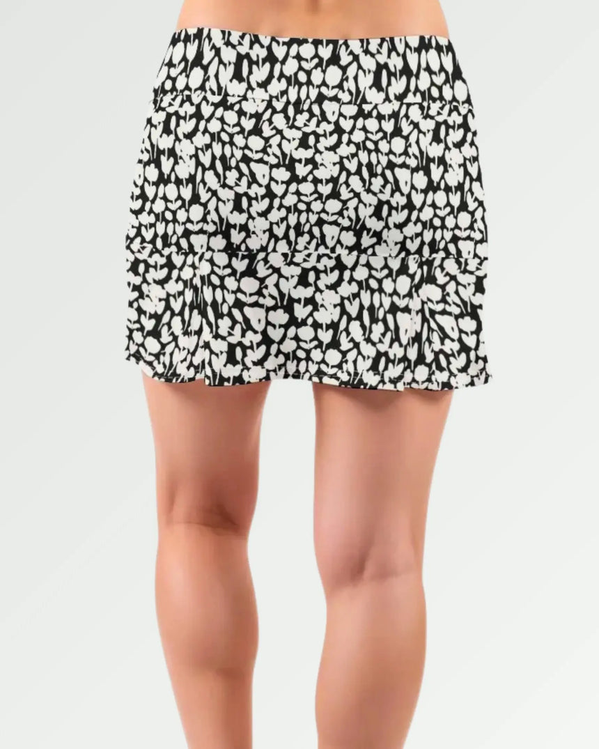 women's pleated golf skort with pockets in Midnight Meadow print - back view