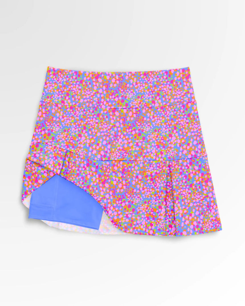 women's pleated golf skort with pockets in Par-tee Confetti print - front view