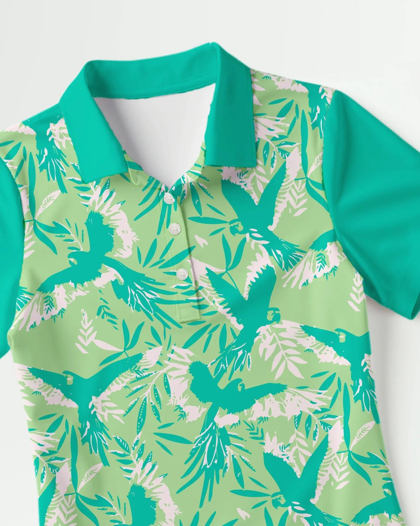 women's short sleeve golf polo in Birds of Paradise print - fabric closeup front view