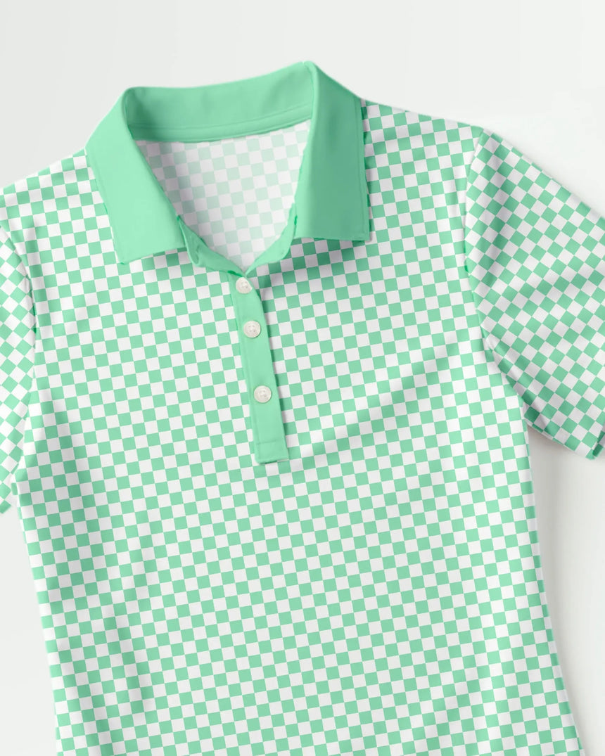 women's short sleeve golf polo in Checkered Greens print - fabric closeup front view