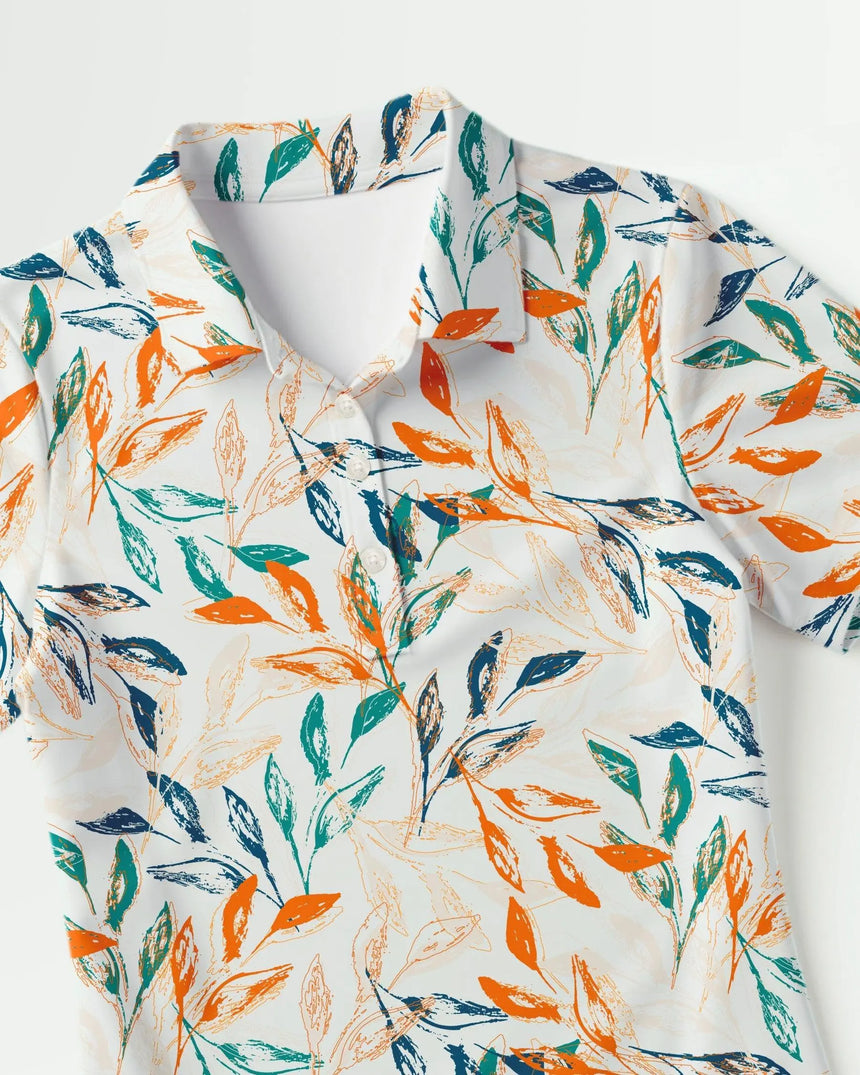 women's short sleeve golf polo in Leaf It On the Green print - fabric closeup front view