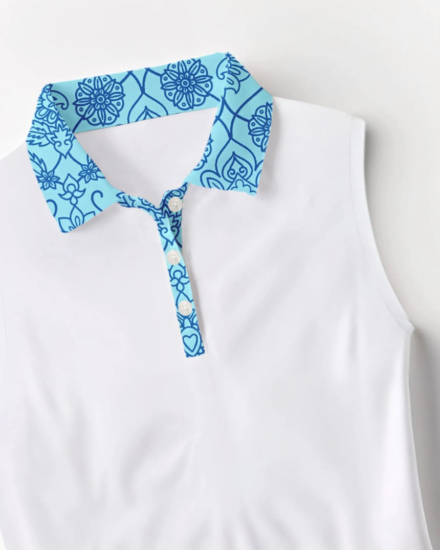 women's sleeveless golf polo in Fore de Fleur print - fabric closeup front view
