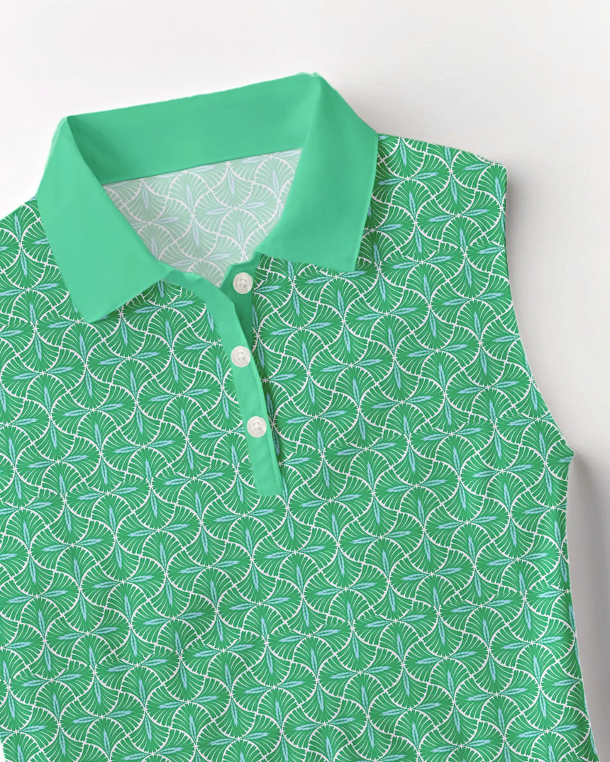 women's sleeveless golf polo in Fairway Fronds print - fabric closeup front view
