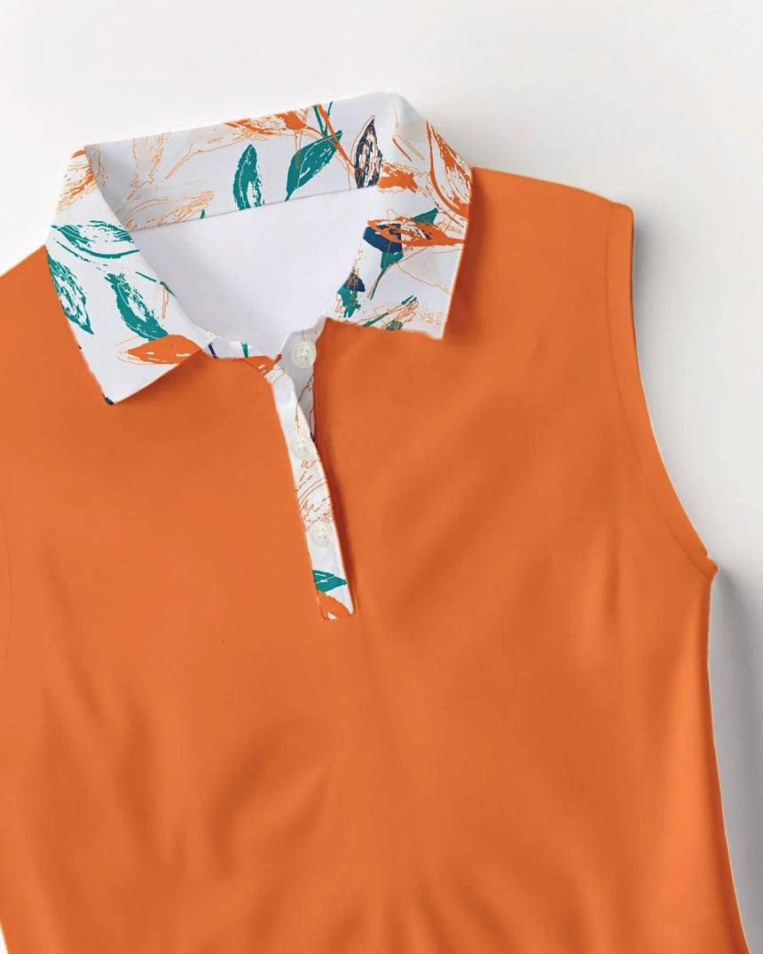 Orange sleeveless golf polo with a patterned collar on a white background