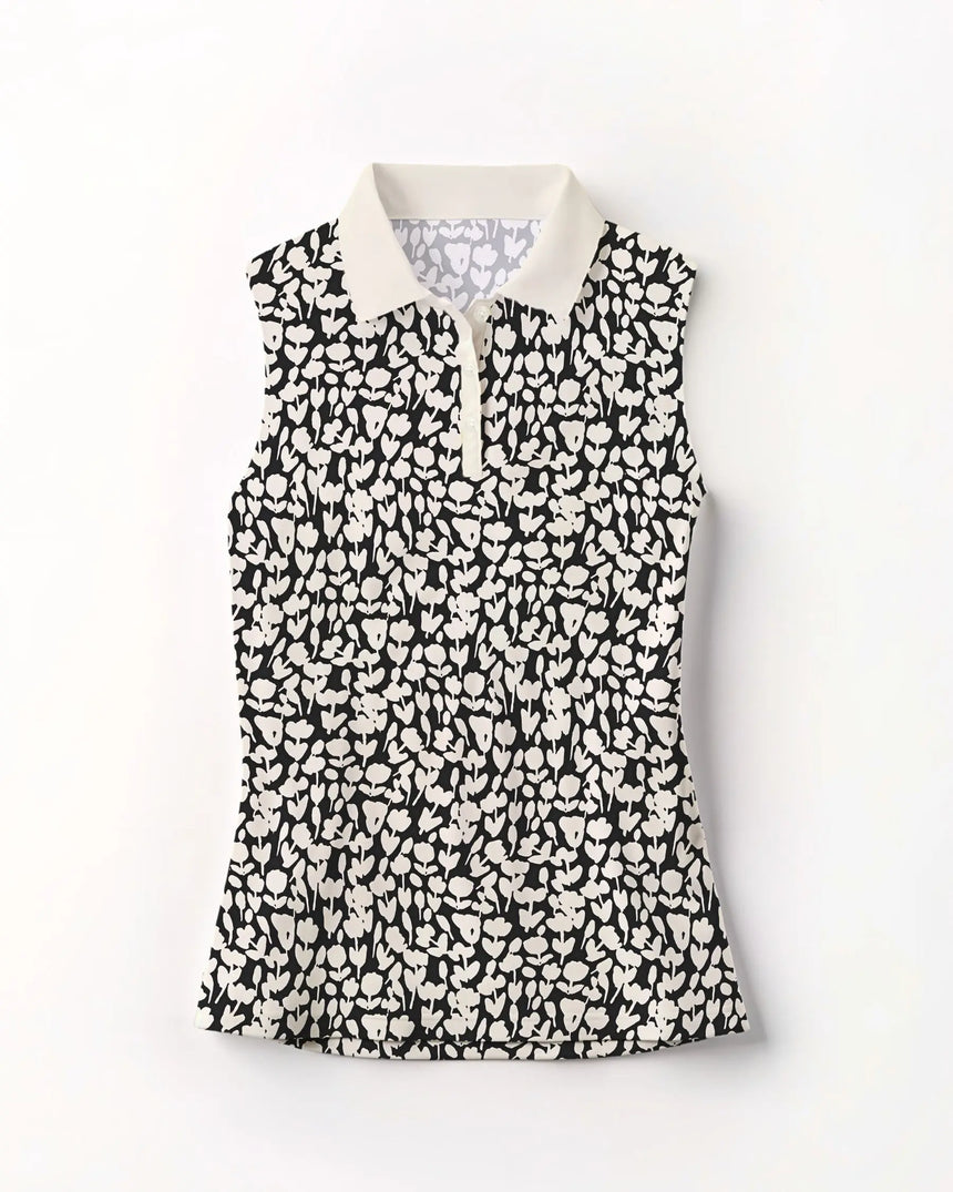 women's sleeveless golf polo in Midnight Meadow print - front view