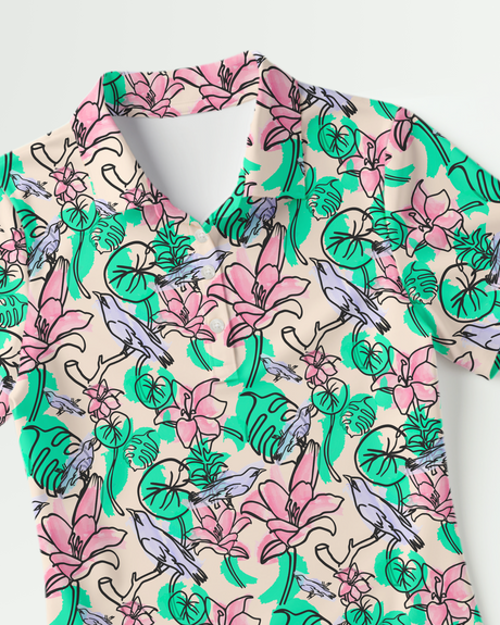 Floral print polo shirt with pink and green flowers and blue birds on a light background