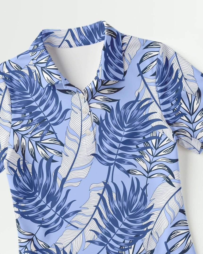 Blue and white leaf patterned women's golf shirt on a white background