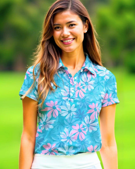 Woman wearing a blue floral golf shirt on a green outdoor background