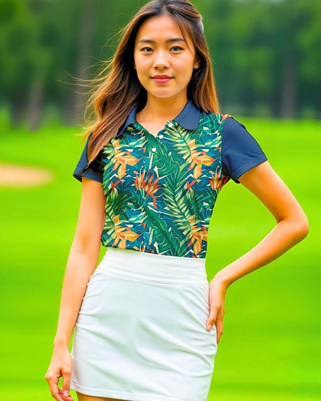 Woman wearing a tropical leaf patterned shirt and white skirt on a golf course