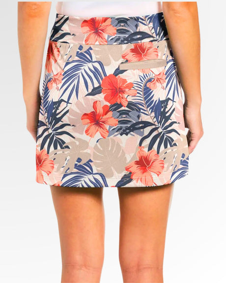 Tropical floral patterned skort worn by a woman on a plain background