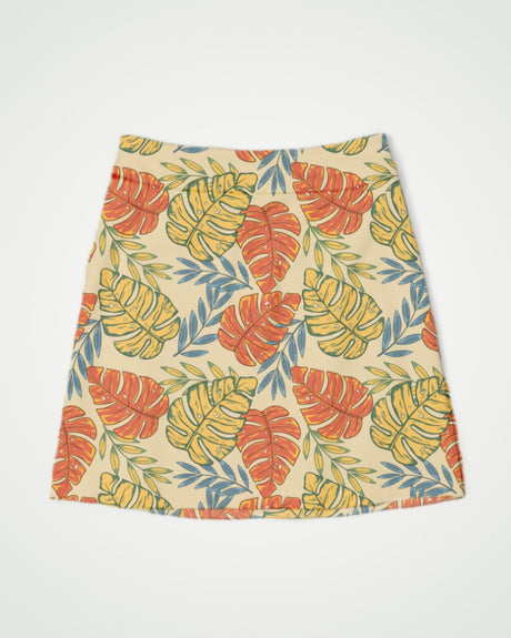 Skirt with tropical leaf pattern on a plain background