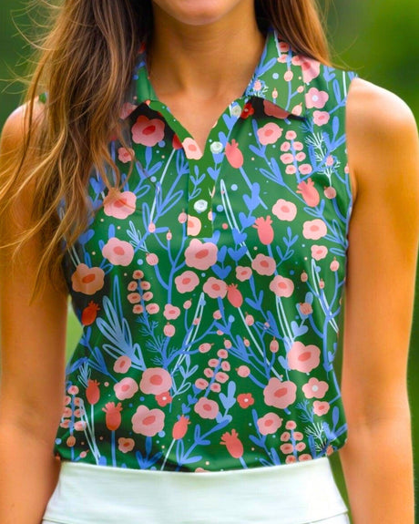 Woman wearing a sleeveless golf polo with a floral pattern against a blurred green background