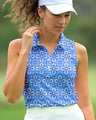 Woman wearing a blue floral patterned sleeveless polo shirt on a golf course