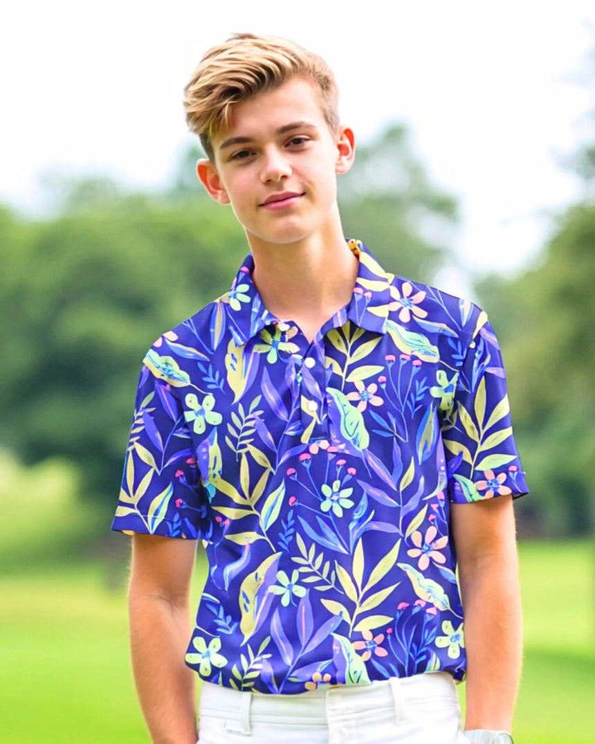 youth short sleeve golf polo in Garden on the Green print - model wearing on course
