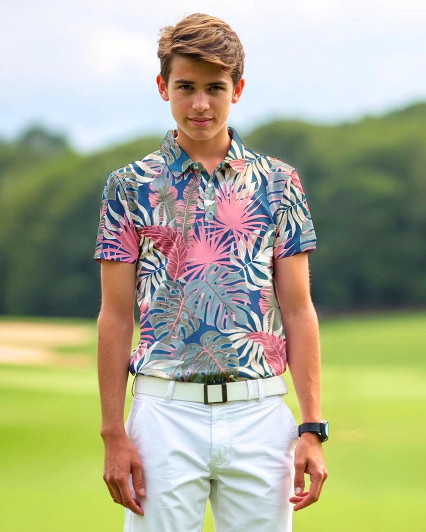 youth short sleeve golf polo in Palm Party print - model wearing on course