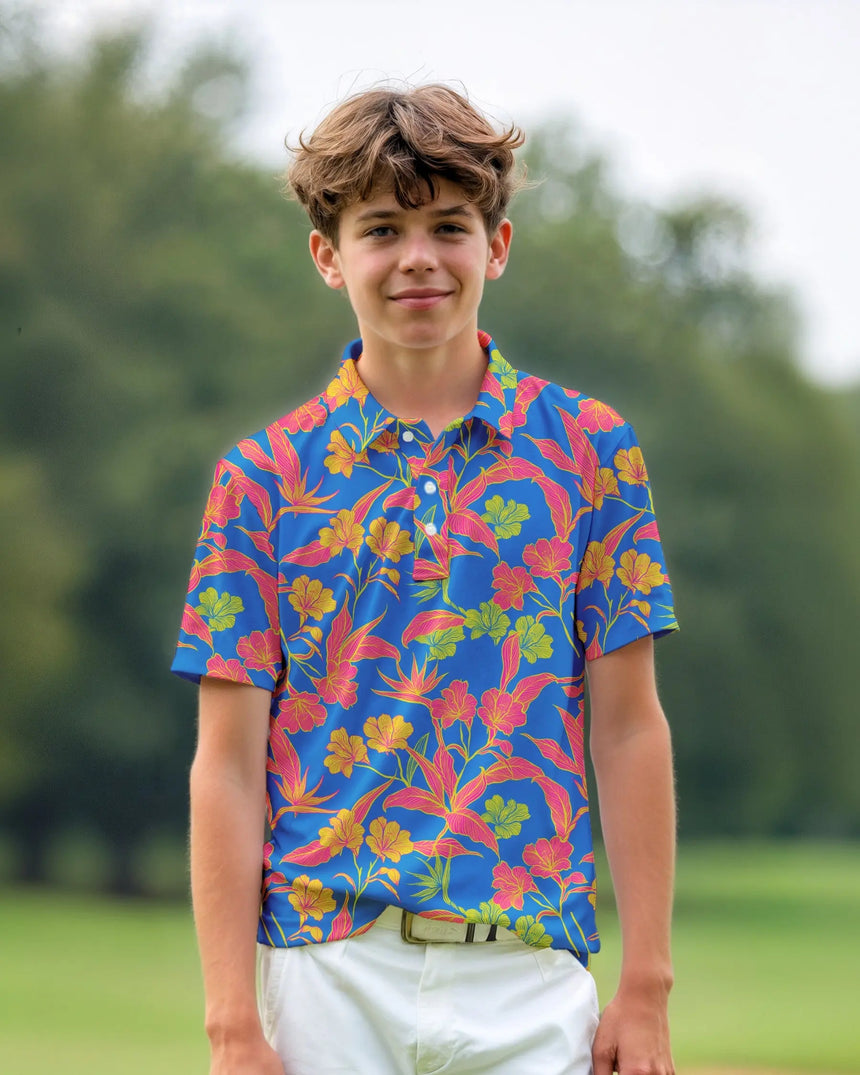 youth short sleeve golf polo in Paradise Found print - model wearing on course