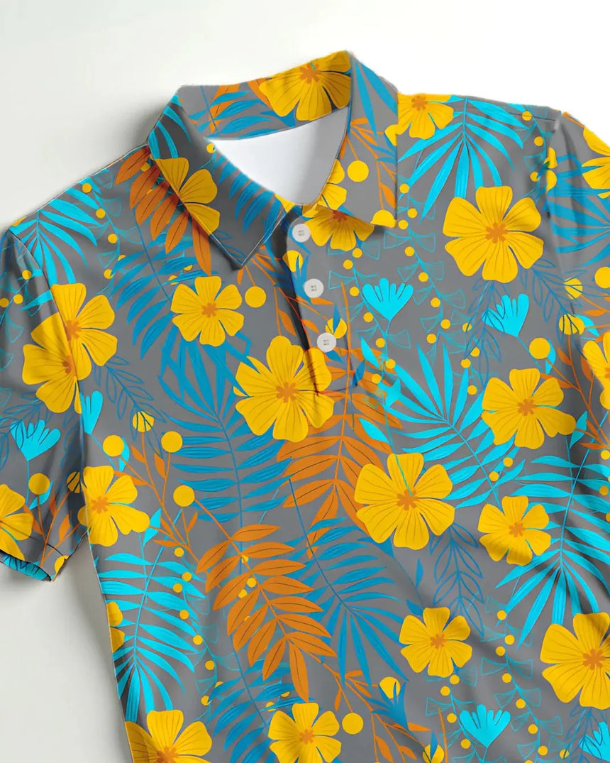 youth short sleeve golf polo in Tropical Mirage print - fabric closeup front view