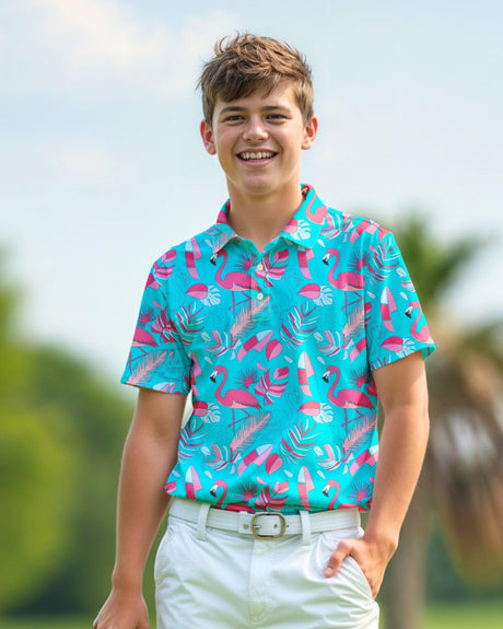 Young boy wearing a colorful flamingo pattern golf shirt outdoors