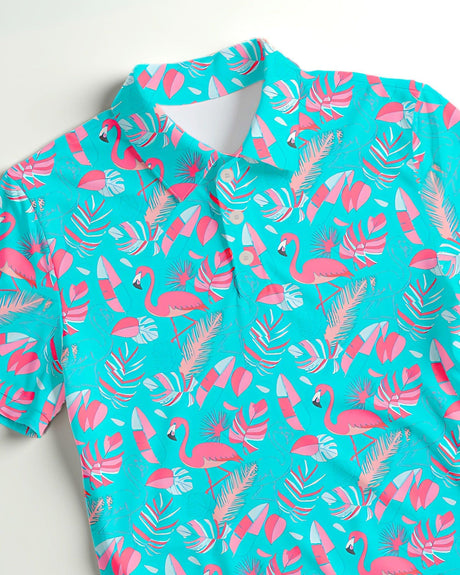 Turquoise shirt with pink flamingo and leaf pattern on a white background