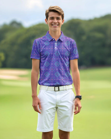 Young boy wearing a purple patterned polo shirt and white shorts on a golf course.