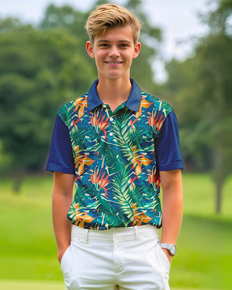 Young boy wearing a colorful leaf-patterned shirt on a golf course
